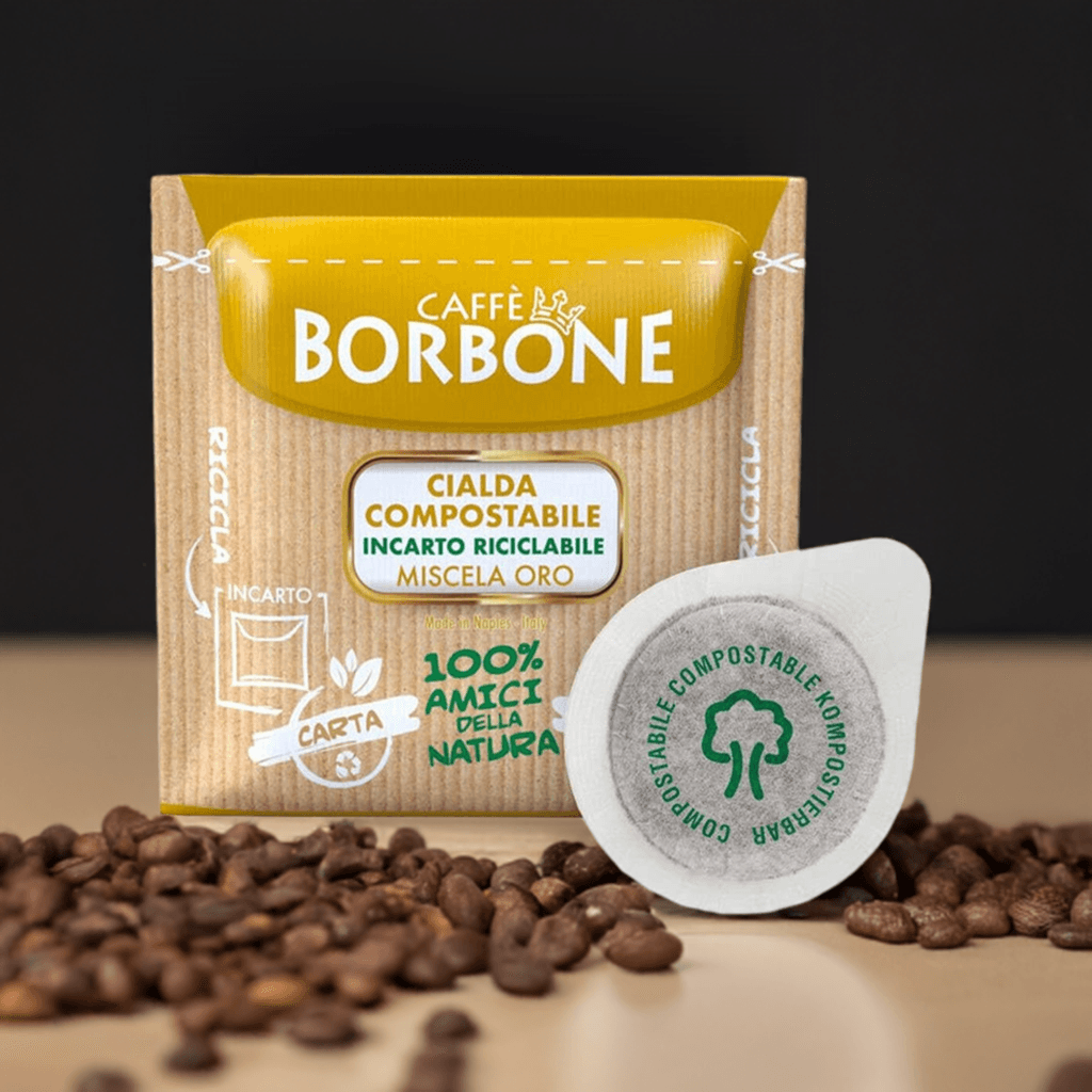 Cialda compostabile Caffè Borbone Oro con confezione riciclabile e chicchi di caffè