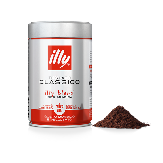 Barattolo di caffè macinato illy tostato classico con polvere di caffè accanto, ideale per moka