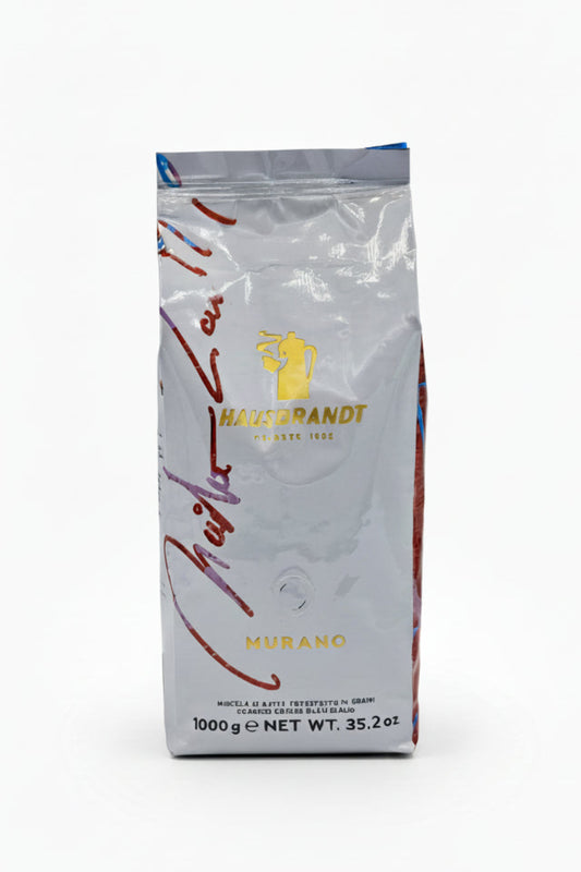 Confezione da 1kg di caffè in grani Hausbrandt Murano su sfondo bianco.